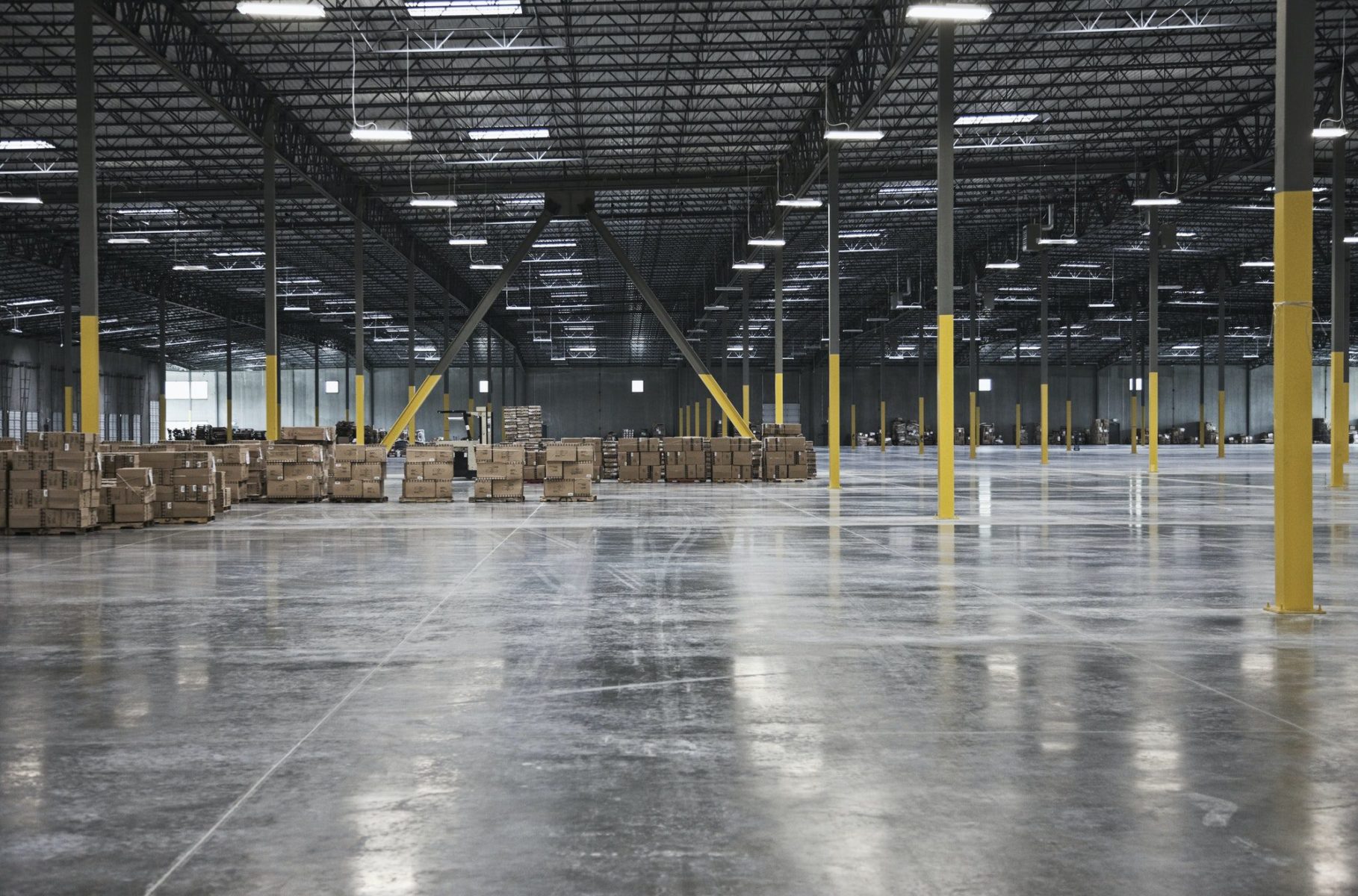 Cardboard boxes in distance in warehouse
